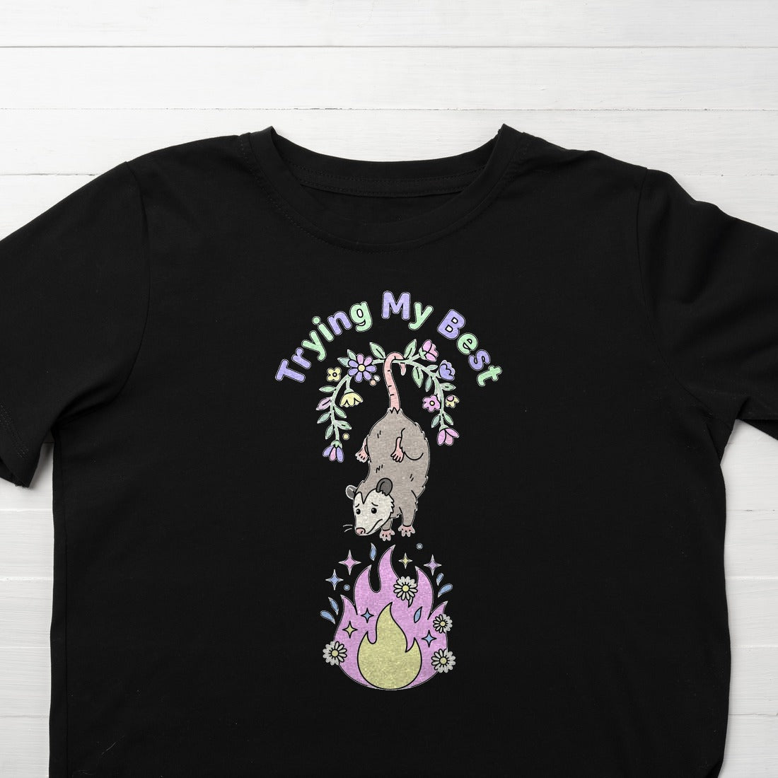 Trying My Best Dumpster Fire Opossum Kids Tee — lifestyle photo