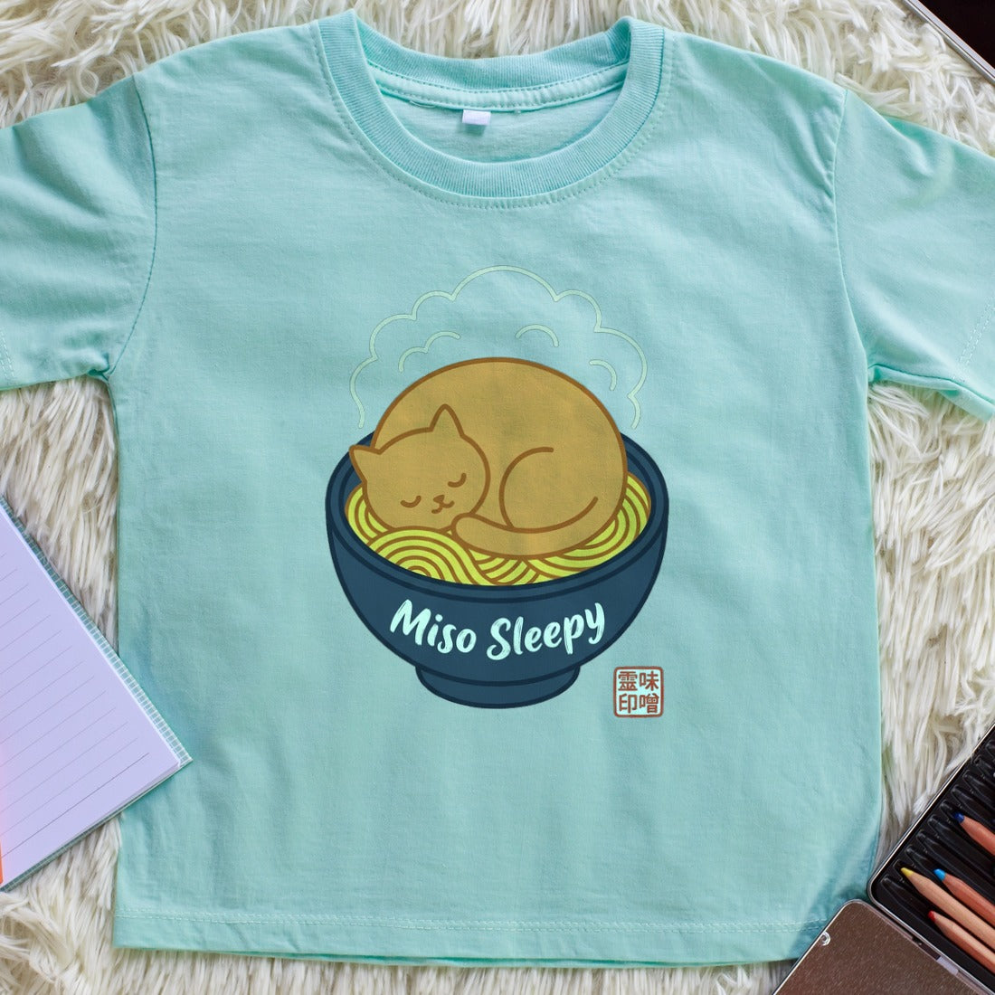 Miso Sleepy Cozy Ramen Cat Kids Tee — lifestyle photo
