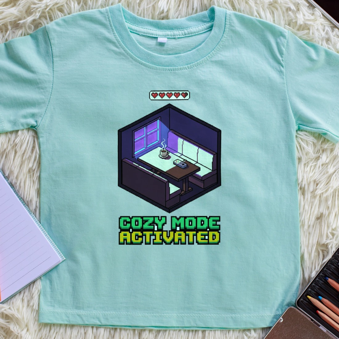 Cozy Mode Isometric Pixel Cafe Booth Kids Tee — lifestyle photo