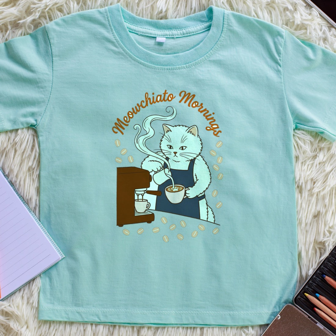 Meowchiato Mornings Cozy Cat Barista Kids Tee — lifestyle photo