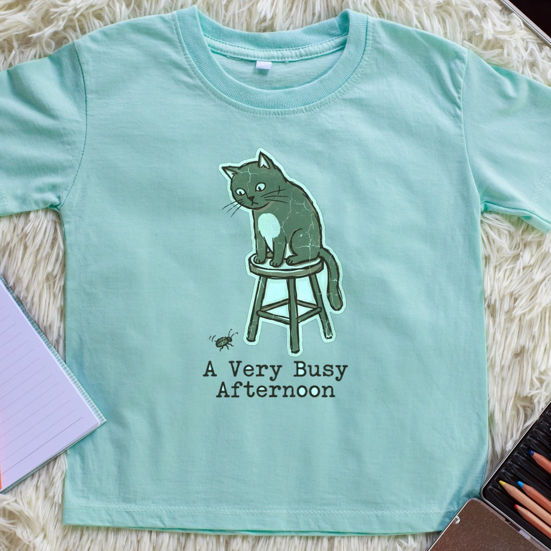 A Very Busy Afternoon Naive Cat Tee Kids Tee — lifestyle photo