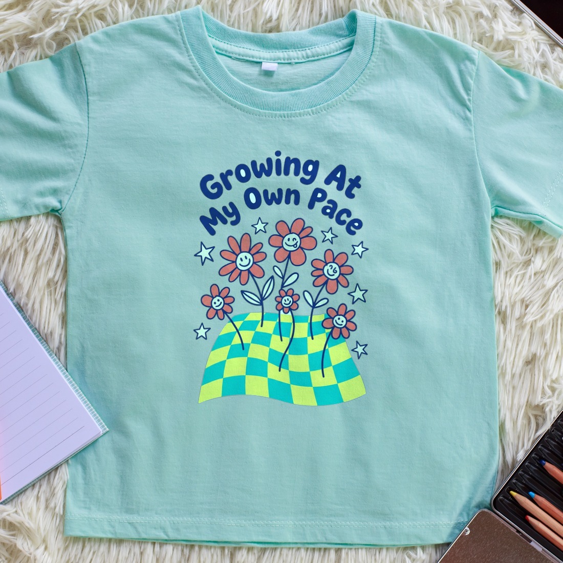 Growing At My Own Pace Wobbly Garden Kids Tee — lifestyle photo