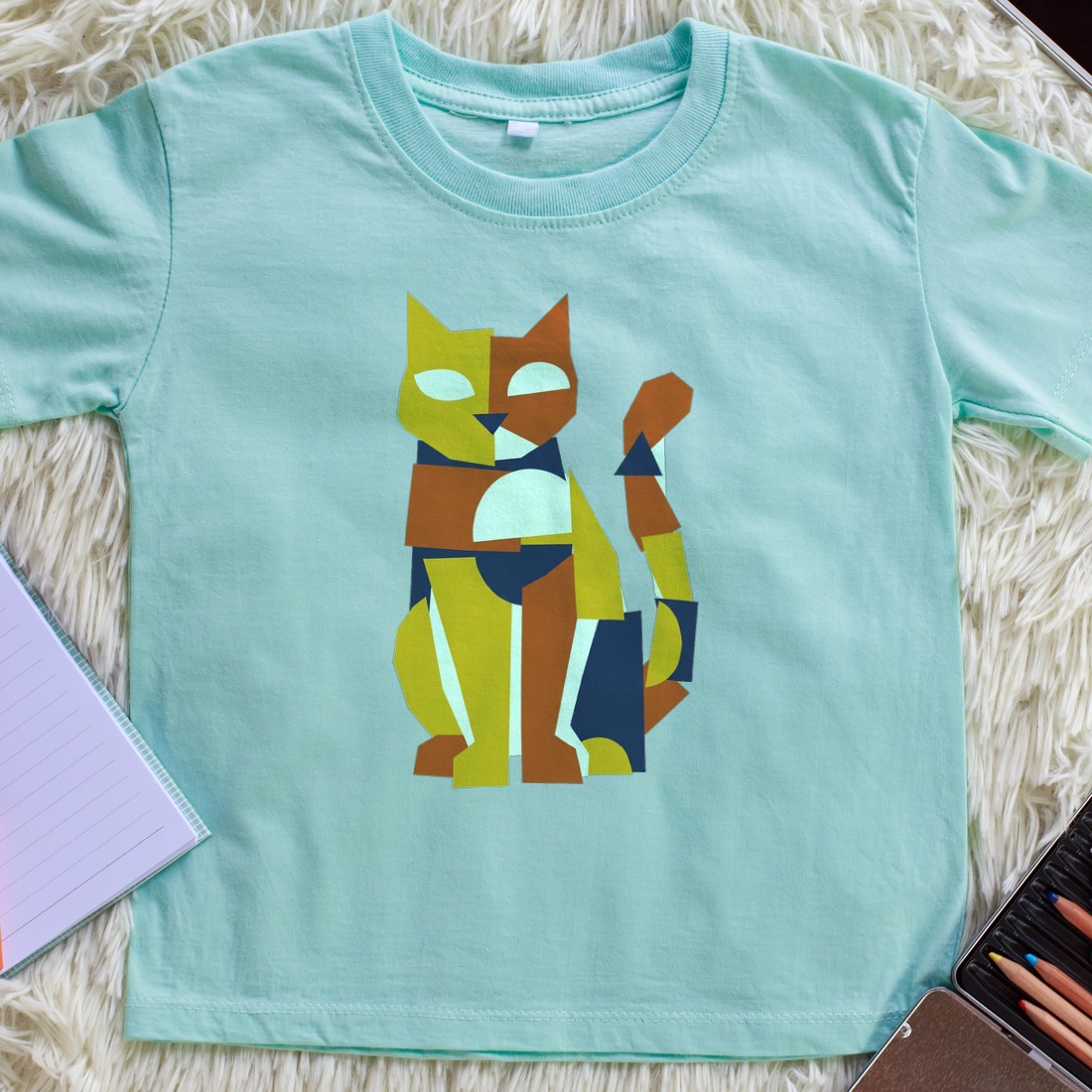 Avant-Garde Paper Cutout Feline Kids Tee — lifestyle photo